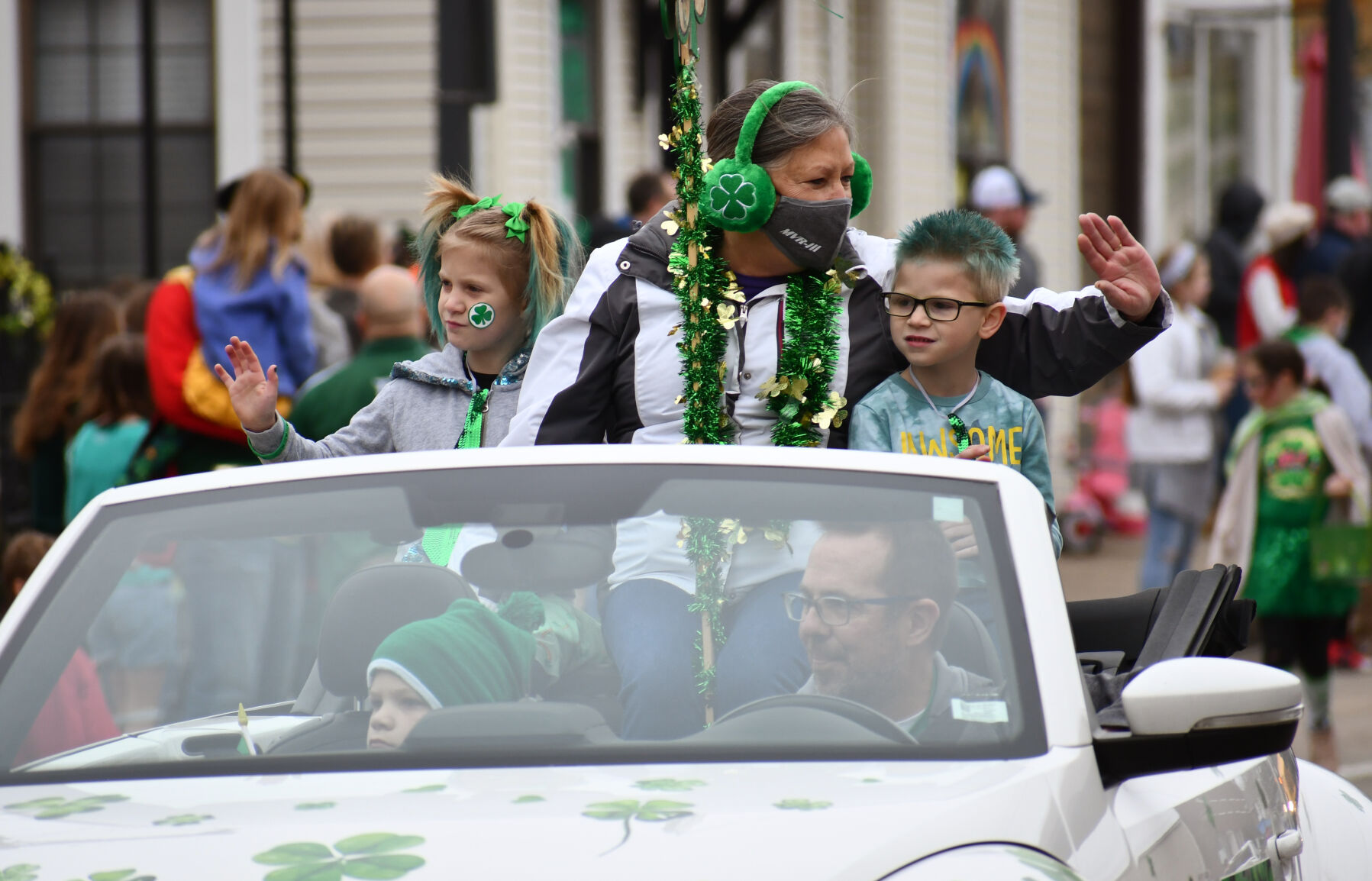 Barb Heger waves to paradegoers